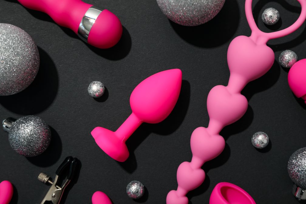 sex toys on black background